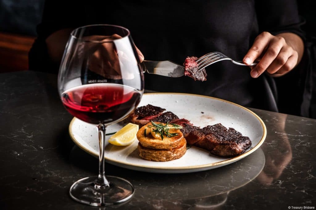 Steak and a glass of red at Black Hide