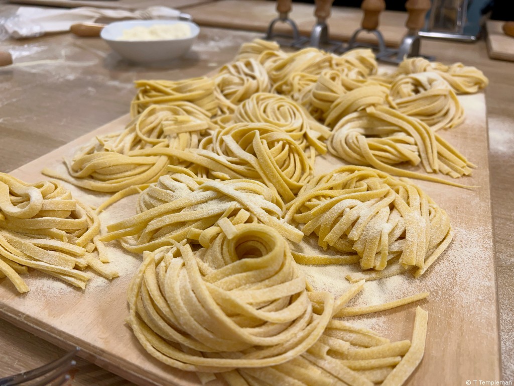Making fettuccine at a Devour Food Tour cooking class