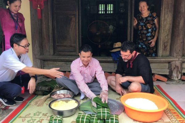 Learning how to make Banh Chung in Vietnam
