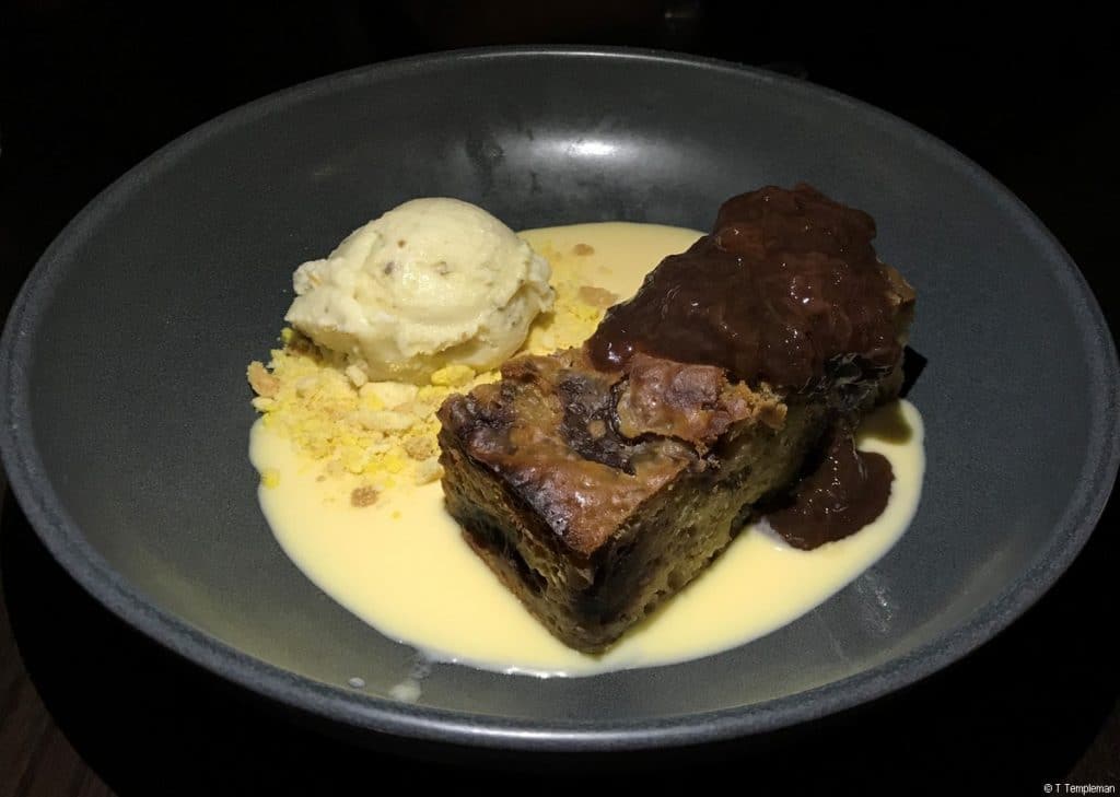 Steamed plum pudding with crème anglaise and more-ish rum and raisin compote