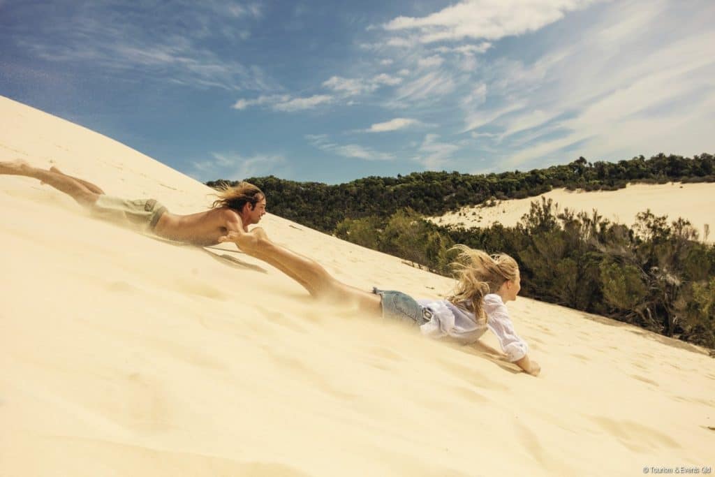 Sand tobogganing on Moreton Island